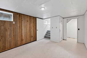 Below grade flex-room with a closet. This space is ideally suited for storage, a hobby room or a future bedroom (buyer to verify city requirements).