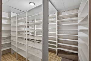 Storage room with wrap-around built-in shelving.