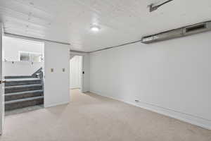 Below grade flex-room with a closet. This space is ideally suited for storage, a hobby room or a future bedroom (buyer to verify city requirements).