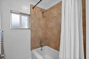 Bathroom features a versatile shower / tub combo, perfect for both quick mornings and relaxing evening soaks. A bright space designed for everyday comfort.