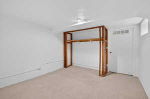 Below grade flex-room with an unfinished closet. This space is ideally suited for storage, a hobby room or a future bedroom (buyer to verify city requirements).