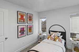 Carpeted bedroom with baseboards