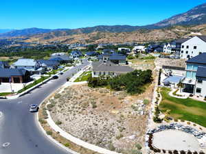 Aerial perspective of suburban area with a mountainous background