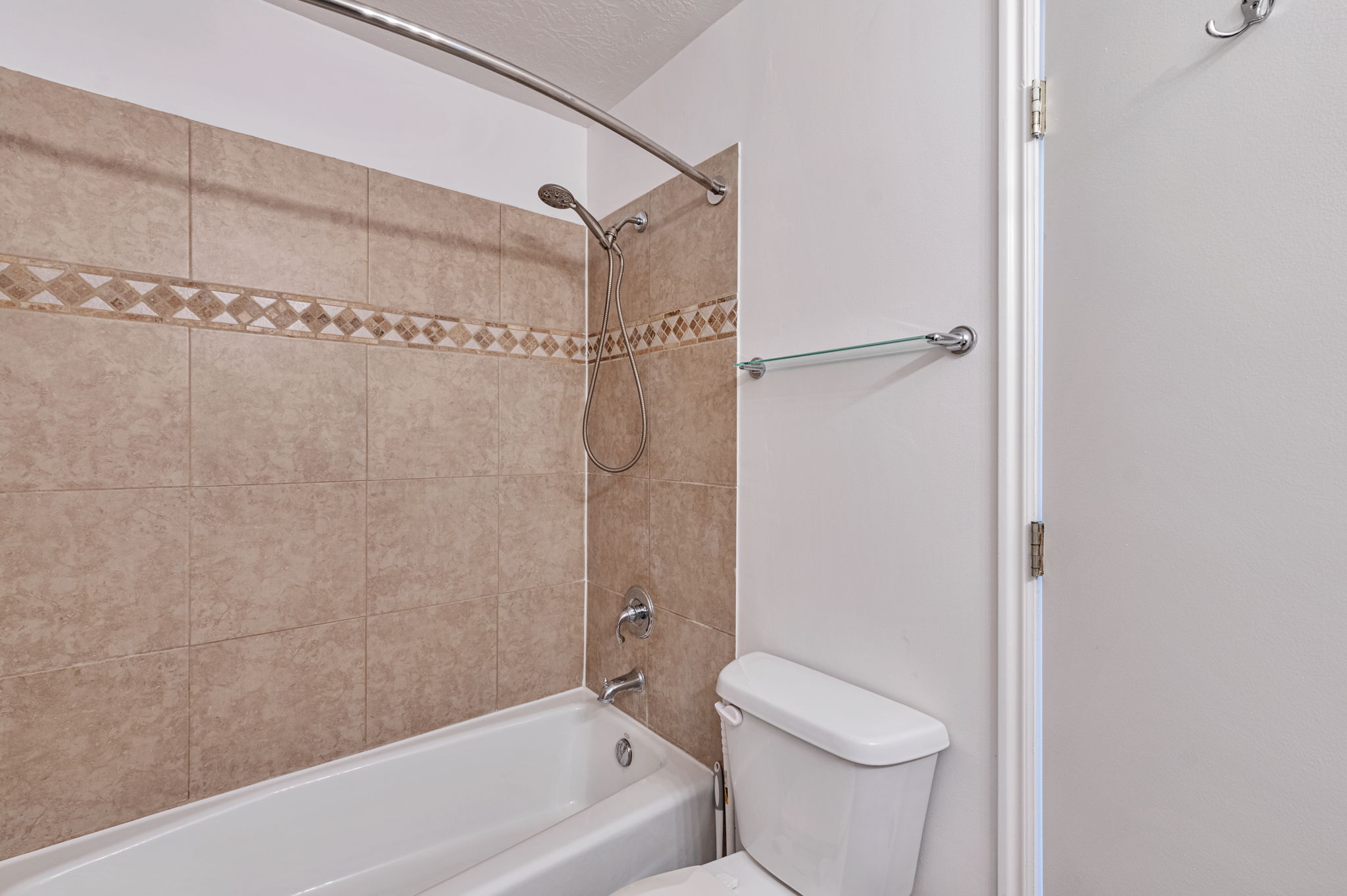 Full bath with shower / bath combination and toilet