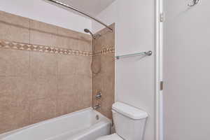 Full bath with shower / bath combination and toilet