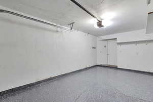 Garage featuring a garage door opener