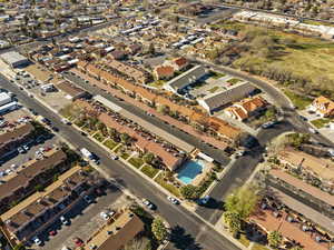 Aerial view of property's location featuring nearby suburban area