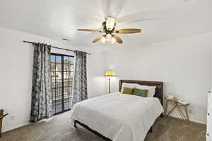 Bedroom featuring carpet floors, a ceiling fan, and access to outside