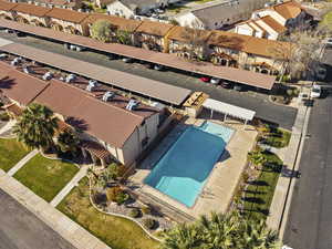 Aerial view of residential area featuring a pool
