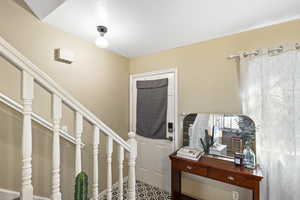 Entryway featuring stairs