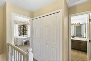 Hall featuring a sink and light wood-style floors