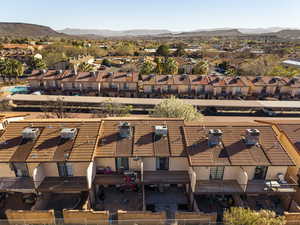 Aerial perspective of suburban area featuring a mountainous background
