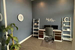 Office space with glass French doors and a large window