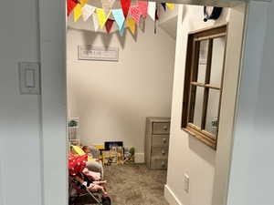 Under stairs playroom featuring recessed lighting