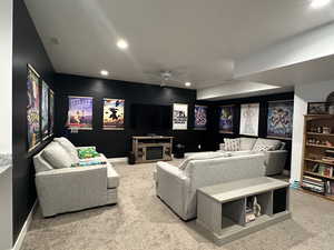 TV area with carpet, a ceiling fan, and recessed lighting