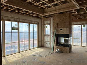 Owner's suite featuring a peninsula fireplace