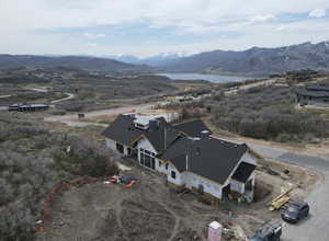 Bird's eye view above the home featuring a mountain backdrop