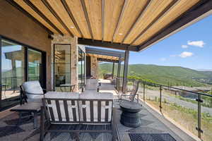 View of patio / terrace with a mountain view and an outdoor lounge area