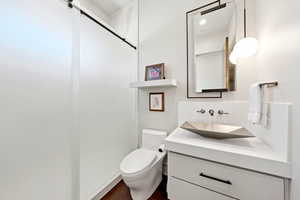Bathroom with vanity and dark wood finished floors