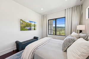 Bedroom featuring wood finished floors and recessed lighting