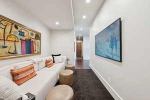 Living area featuring recessed lighting and baseboards