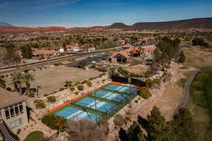 Aerial perspective of suburban area with a mountain backdrop