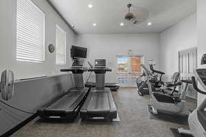 Workout room featuring recessed lighting