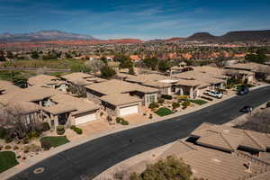 Aerial view of residential area featuring a mountainous background