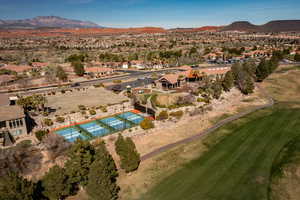 Aerial overview of property's location featuring a mountainous background and nearby suburban area