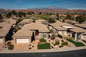 Aerial view of residential area featuring a mountainous background