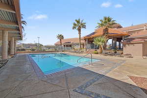 Community pool with a patio area
