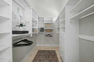 Walk in closet featuring light tile patterned floors