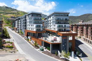 View of apartment building / complex featuring a mountain view