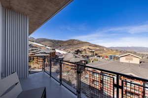 Balcony with a mountain view and a residential view