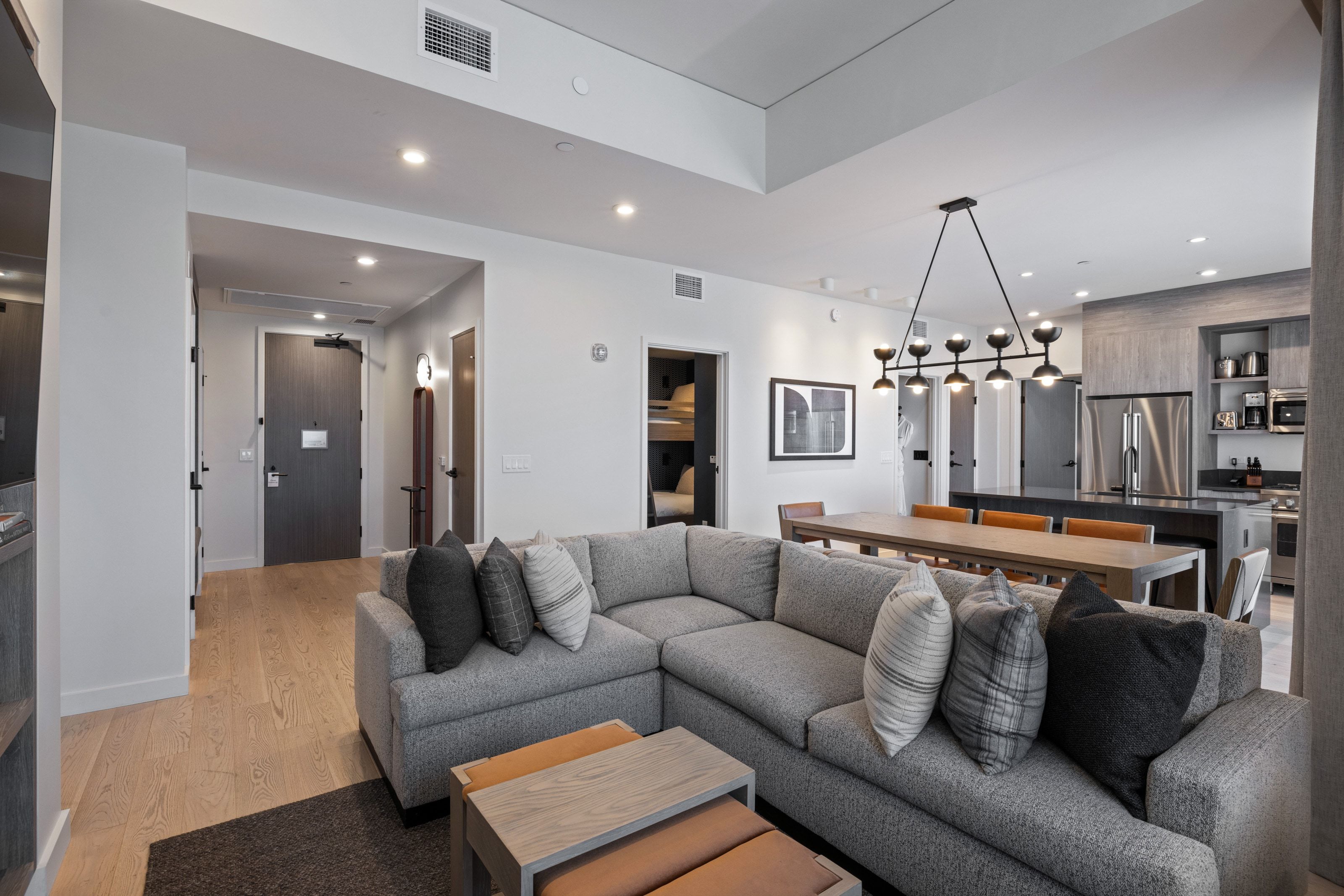 Living room with recessed lighting and light wood-style floors