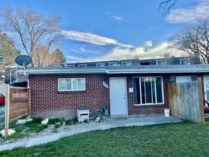 Unit 4365 Front view of duplex featuring brick and a separate patio