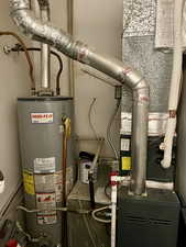 Unit 4367 Utility room with water heater and heating unit