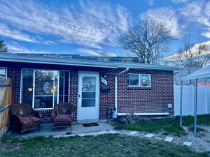 Unit 4367 Front View of exterior entry featuring brick, and secluded patio
