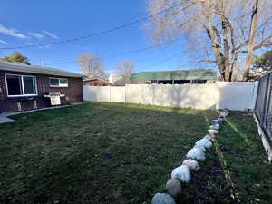 Unit 4365 View of fenced backyard and covered parking