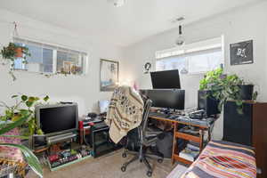 Office space featuring light carpet