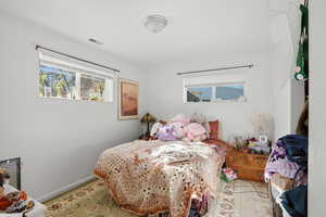 Bedroom featuring multiple windows