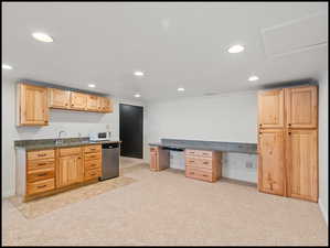 Large family room with built-n cabinetry, wet bar, and mini fridge