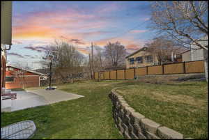 Fenced backyard with a patio area