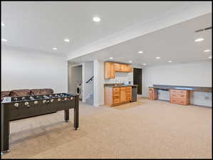 Large family room with built-n cabinetry, wet bar, and mini fridge