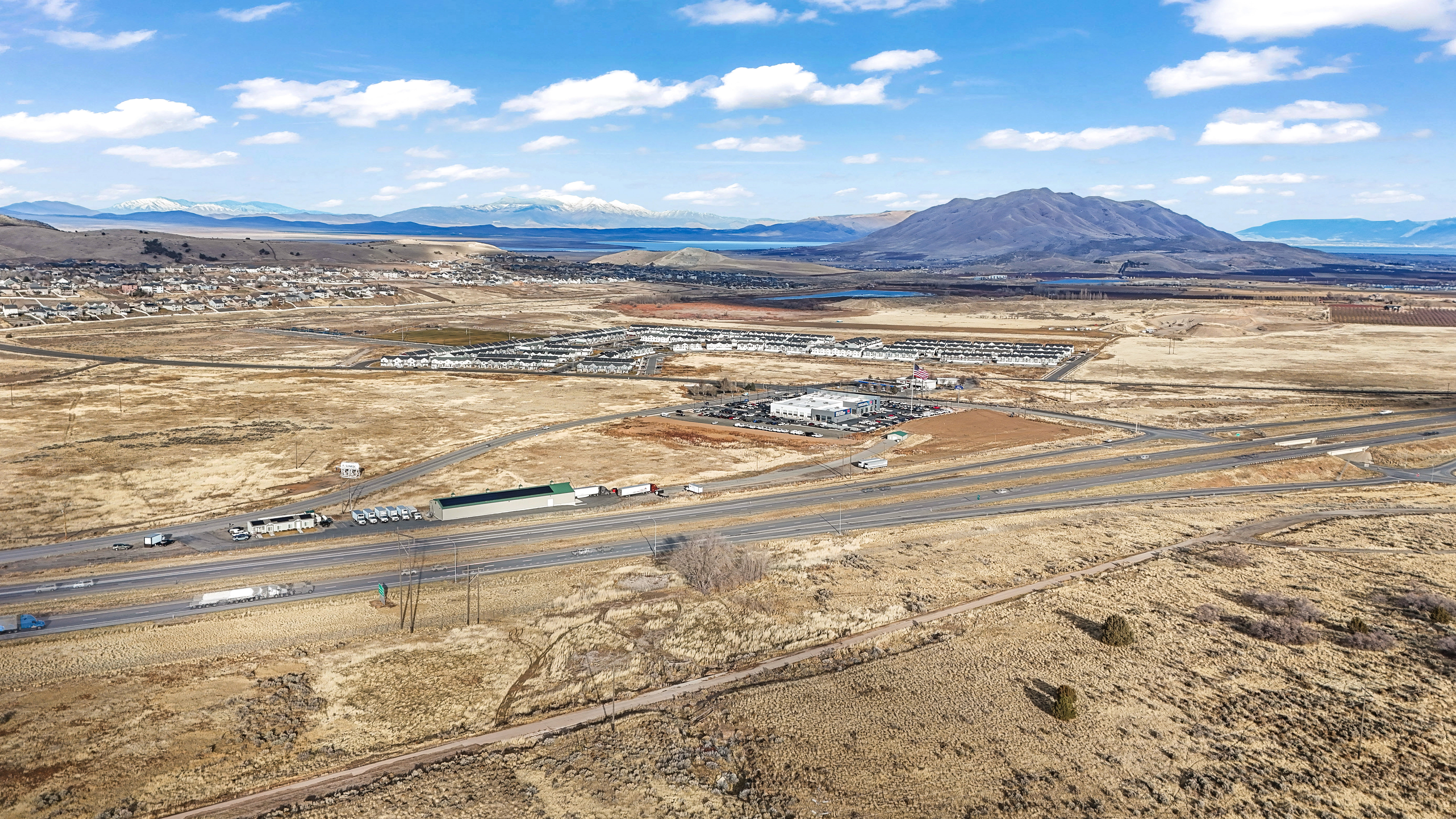 Overview of rural landscape featuring a mountainous background