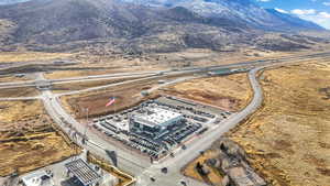 Aerial view of property and surrounding area featuring mountains