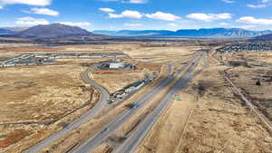 Overview of rural landscape with a mountainous background and a desert landscape