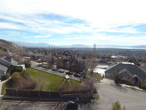 Aerial perspective of suburban area with a mountainous background