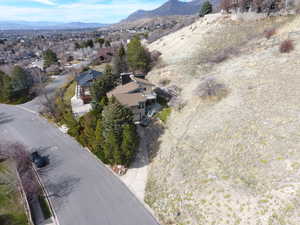 Aerial view of residential area featuring a mountainous background
