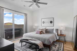 Bedroom featuring access to outside, light wood-type flooring, a ceiling fan, and recessed lighting